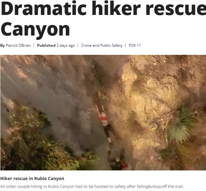 滑り落ちる女性を真下で構える救急隊員（画像は『FOX 11 Los Angeles　2020年1月25日付「Dramatic hiker rescue in Rubio Canyon」』のスクリーンショット）