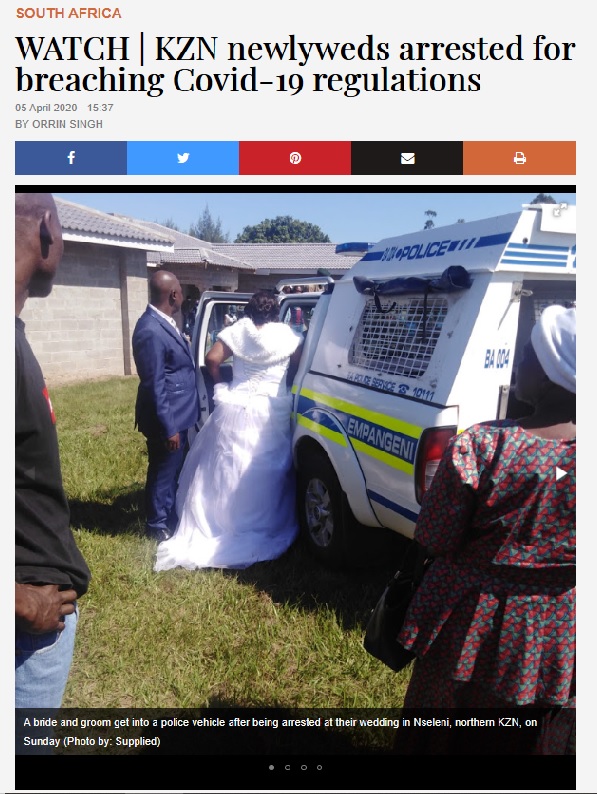 エスコートされてパトカーに乗る新婦（画像は『TimesLIVE　2020年4月5日付「WATCH | KZN newlyweds arrested for breaching Covid-19 regulations」』のスクリーンショット）
